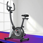 Everfit magnetic upright exercise bike with digital display, adjustable seat, green frame for home gym cardio workouts.