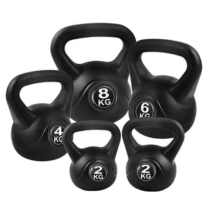 Set of five black kettlebells from Online Fitness Depot for strength training and fitness exercises.