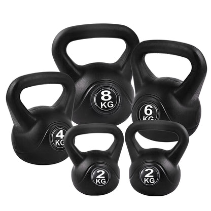 Set of five black kettlebells from Online Fitness Depot for strength training and fitness exercises.
