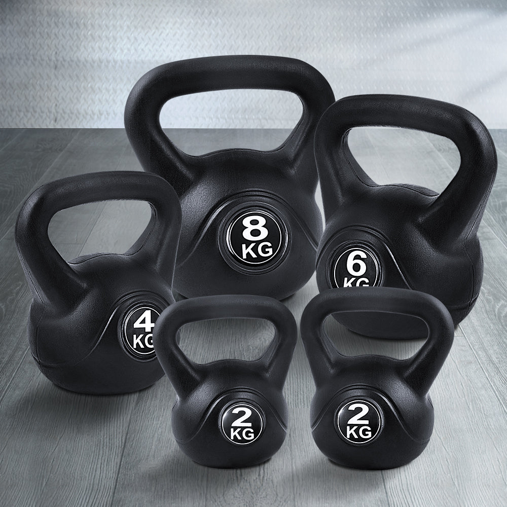 Set of five black kettlebells from Online Fitness Depot for strength training and fitness workouts.