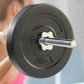 Everfit 18kg barbell set with weight plates on a lifting bench, featuring a 168cm bar for strength training and gym workouts.
