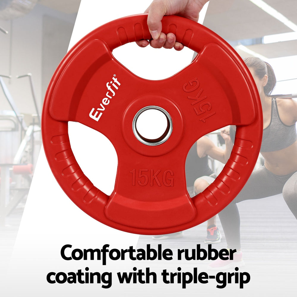 Red Everfit 15kg Olympic weight plates with matching dumbbell and barbell for home gym strength training.