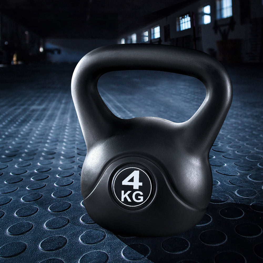 Black Everfit 4kg kettlebell set with matching dumbbells and weight lifting bench for home gym workouts.