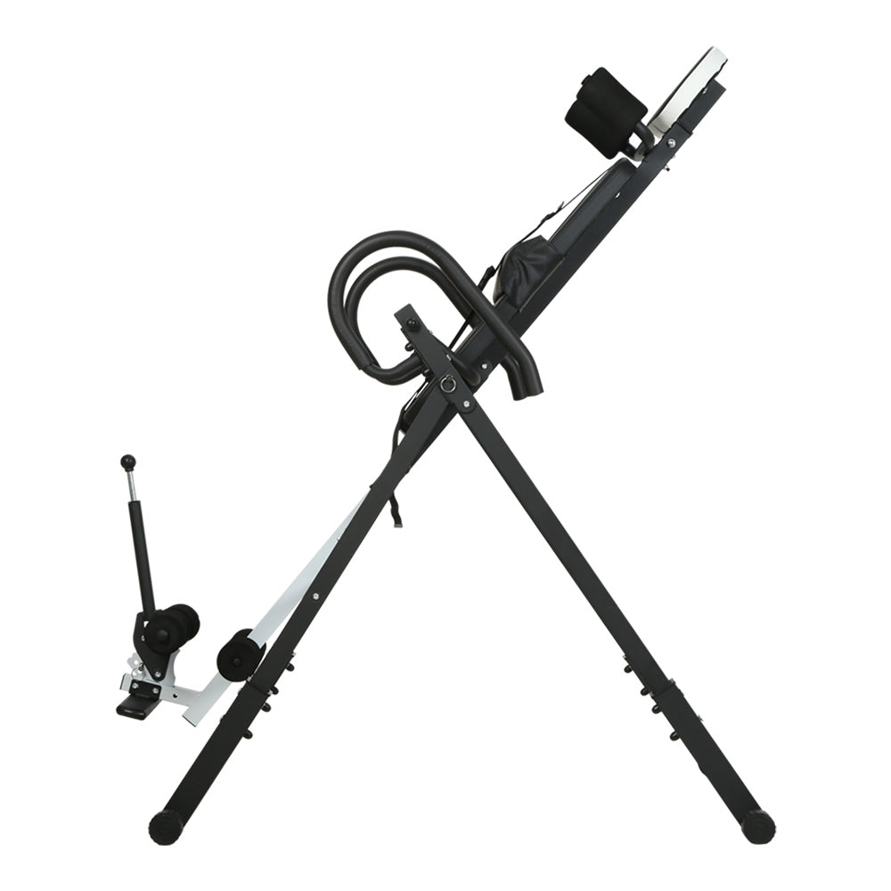 Everfit inversion table in grey, used for back stretching and gravity exercises, with padded support and sturdy frame.