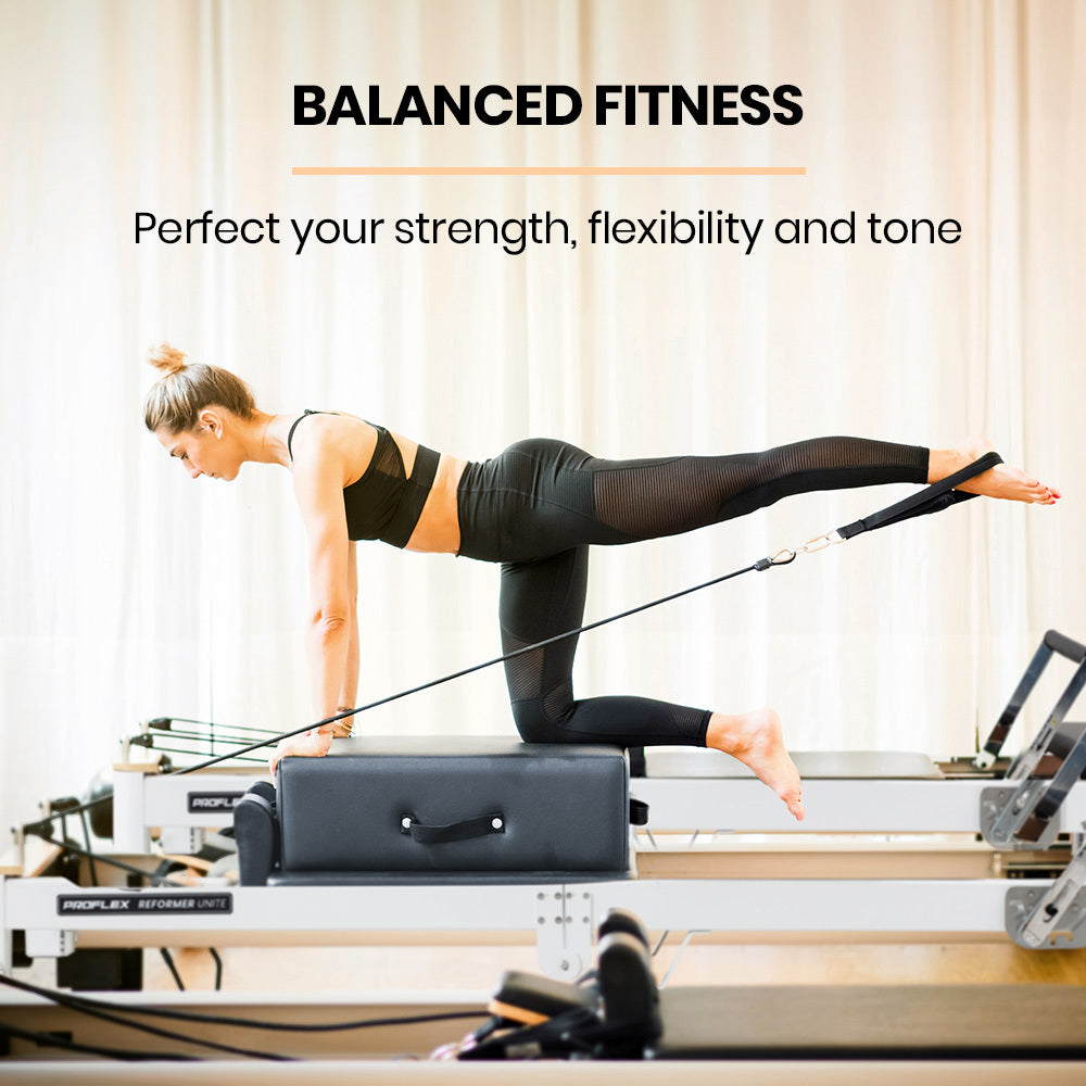 Aluminium Pilates Reformer Machine with stretch bed, box, and jump board accessories for yoga and Pilates workouts.