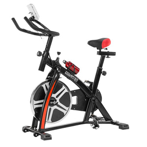 Black Powertrain home gym spin bike with adjustable seat and handlebars, featuring a durable flywheel for indoor cycling workouts.