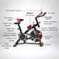 Black Powertrain home gym spin bike with flywheel for indoor cycling, featuring a sturdy frame and adjustable seat for fitness workouts.