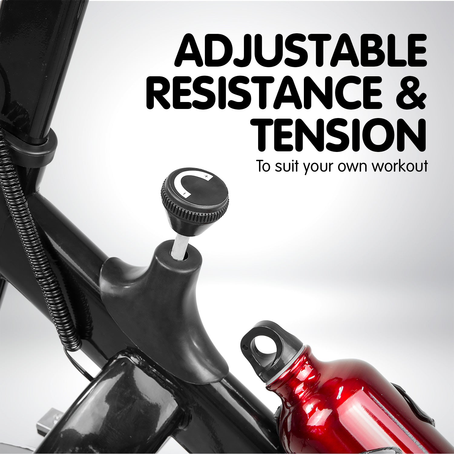 Black Powertrain home gym spin bike with adjustable seat and handlebars, featuring a durable flywheel for indoor cycling workouts.