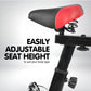 Black Powertrain Home Gym Flywheel Spin Bike with adjustable seat and handlebars for indoor cycling workouts.