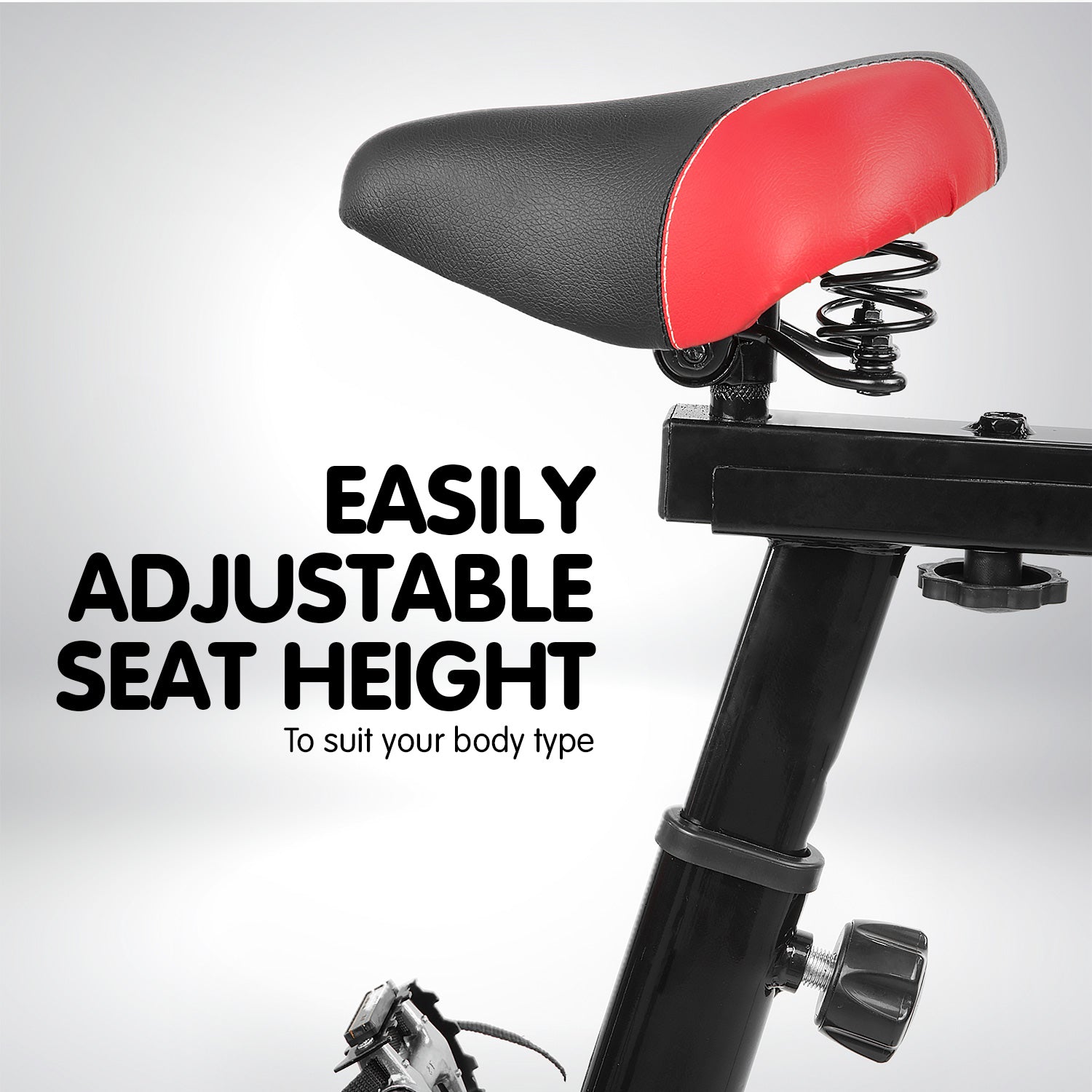 Black Powertrain Home Gym Flywheel Spin Bike with adjustable seat and handlebars for indoor cycling workouts.