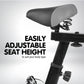 Blue Powertrain home gym flywheel exercise spin bike with adjustable seat and handlebars for indoor cycling workouts.