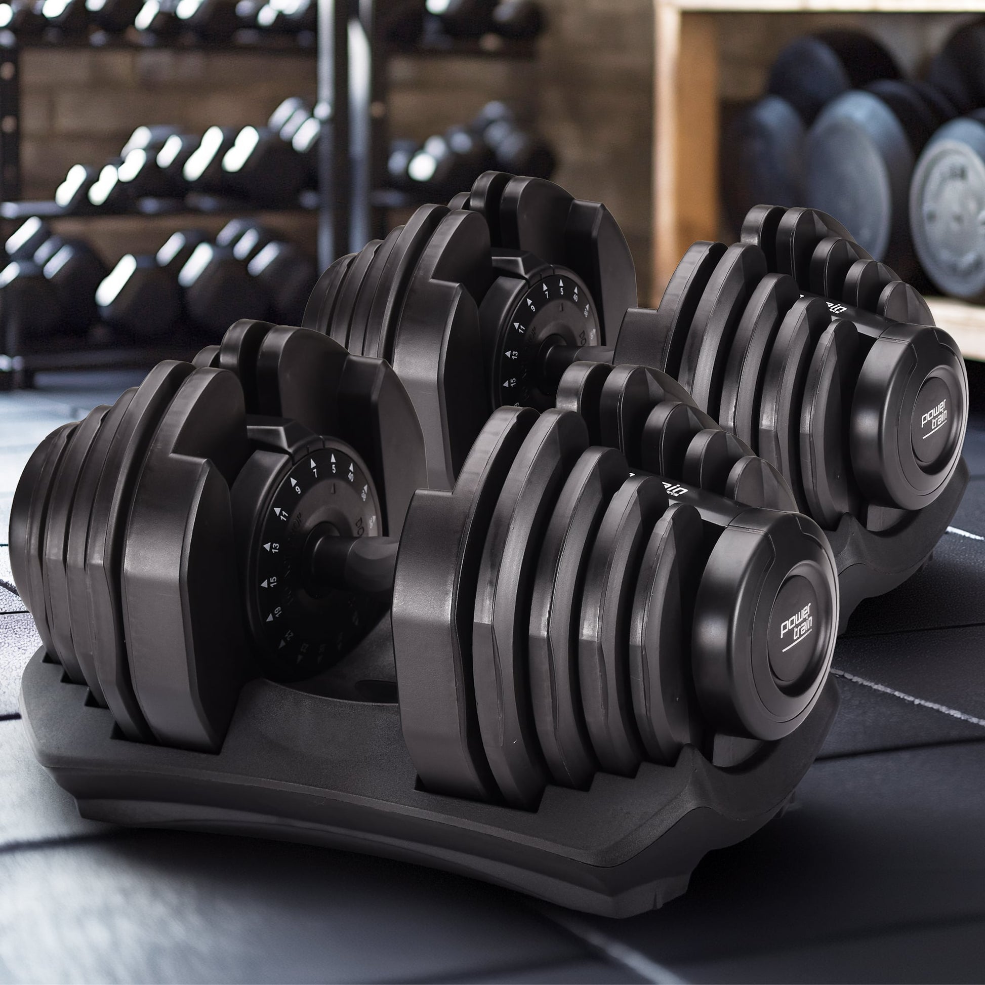 Online Fitness Depot Powertrain 2x40kg adjustable dumbbells for home gym, featuring weight plates and ergonomic handles.
