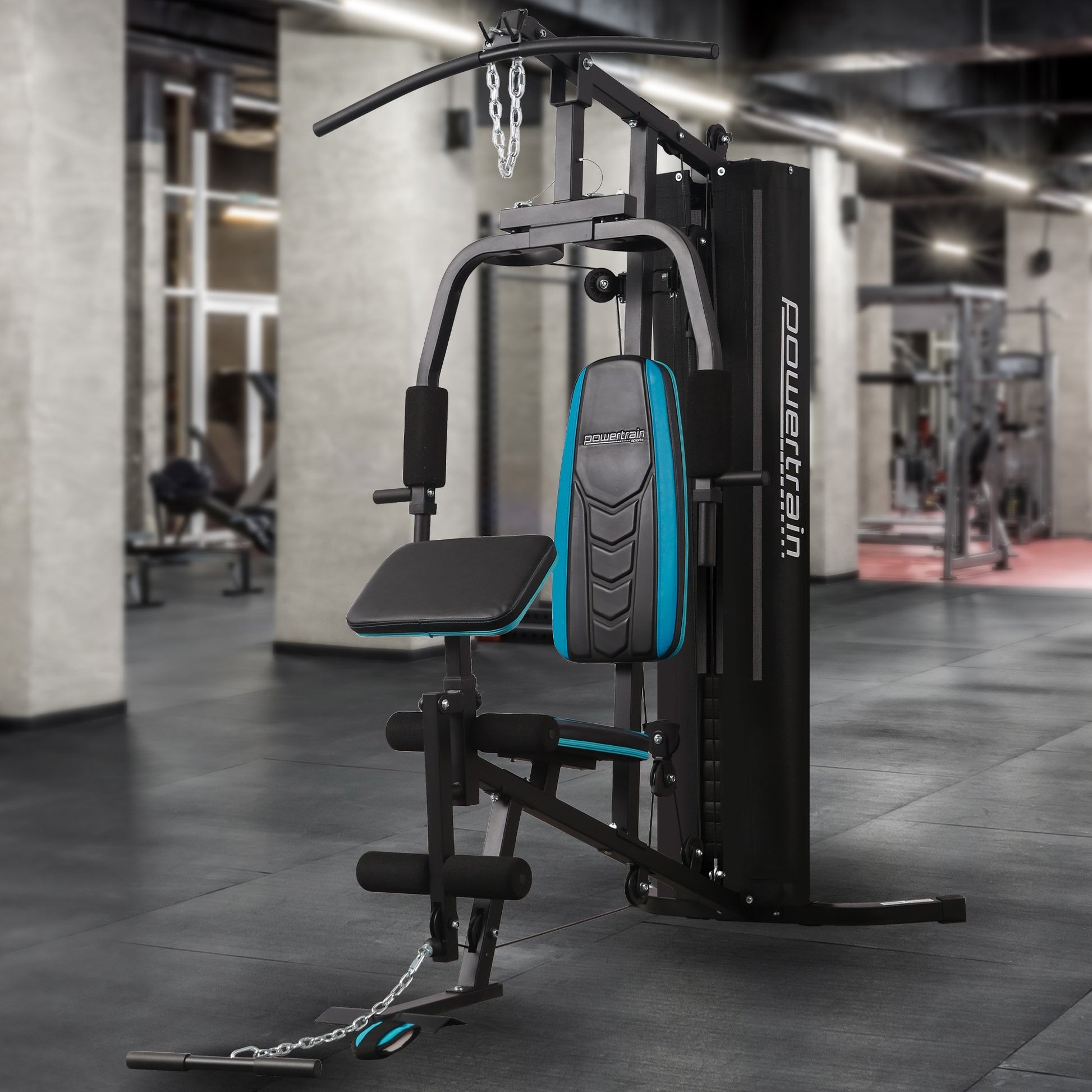 Powertrain JX-300 multi-station home gym with 44kg weight stack, curl pad, leg extension, and pull-down bar for full-body workouts.