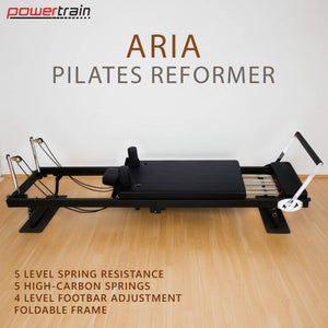 Powertrain Aria Steel Foldable Pilates Reformer with footbar, jumpboard, and sitting box for full-body indoor and outdoor fitness.