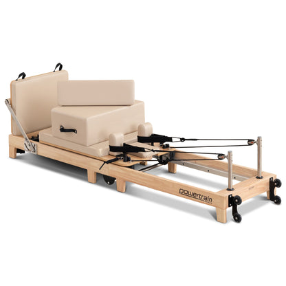 Powertrain Selina Pilates Reformer Machine with wooden frame, jumpboard, and sitting box for home gym fitness and Pilates exercises.