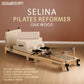 Wooden Powertrain Selina Pilates Reformer Machine with jumpboard and sitting box, beige oak finish, versatile home gym equipment.