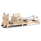 Powertrain Selina Pilates Reformer Machine with wooden frame, jumpboard, sitting box, in oak beige for home gym workouts.