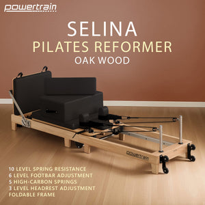 Powertrain Selina Pilates Reformer Machine in black with wooden frame, jumpboard, and sitting box for home gym fitness exercises