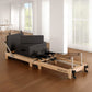 Wooden Selina Pilates Reformer machine with black finish, includes jumpboard and sitting box for home Pilates workouts.