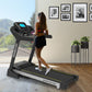 Powertrain K2000 treadmill with fan and auto incline, showing a running belt, digital display, and control panel for fitness training.