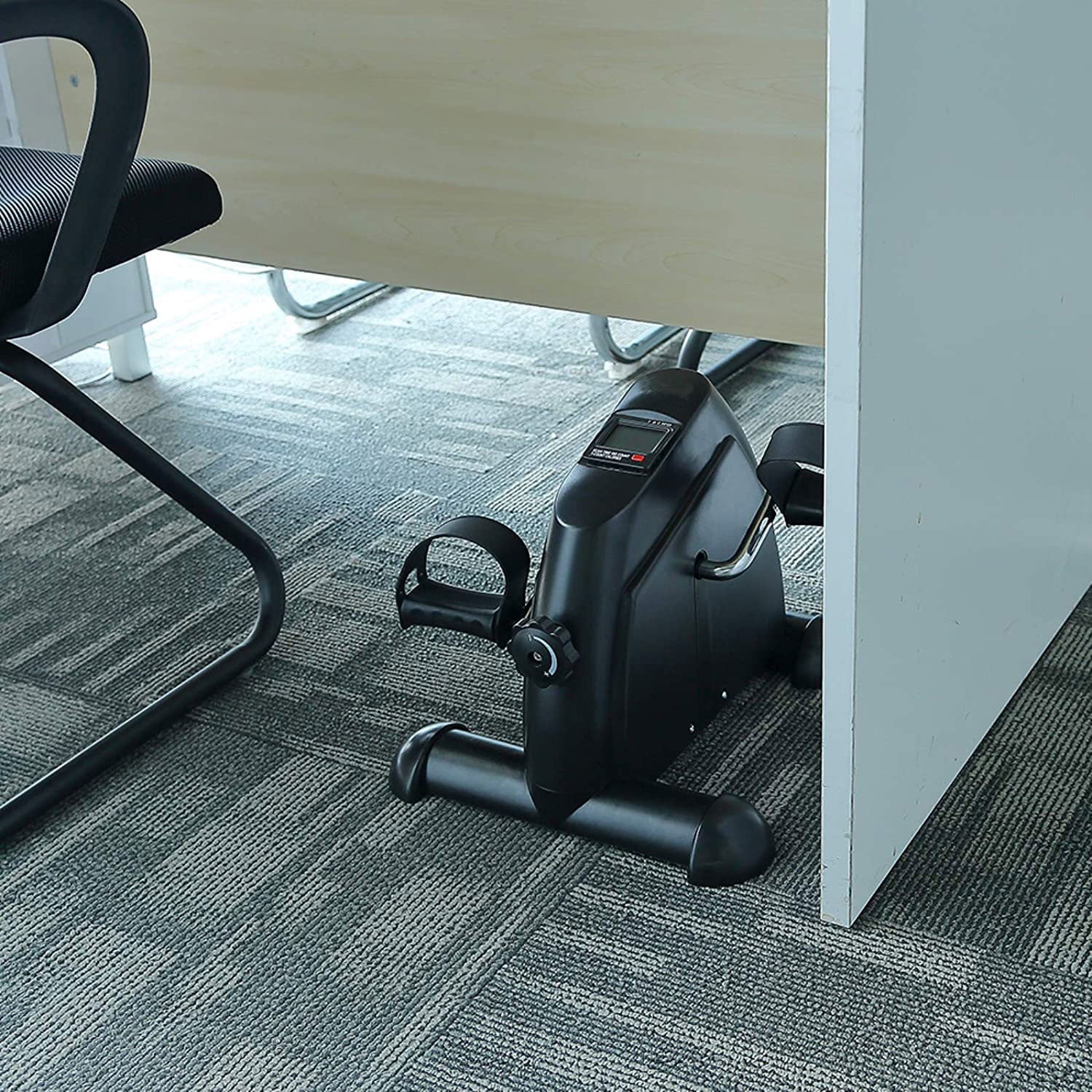 Mini exercise bike pedaling in use, compact indoor cycle trainer from Online Fitness Depot for home gym workouts.