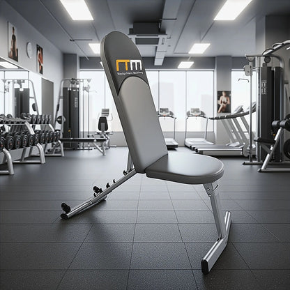 Adjustable FID flat incline decline bench press by Online Fitness Depot, with padded seat and multiple position settings.