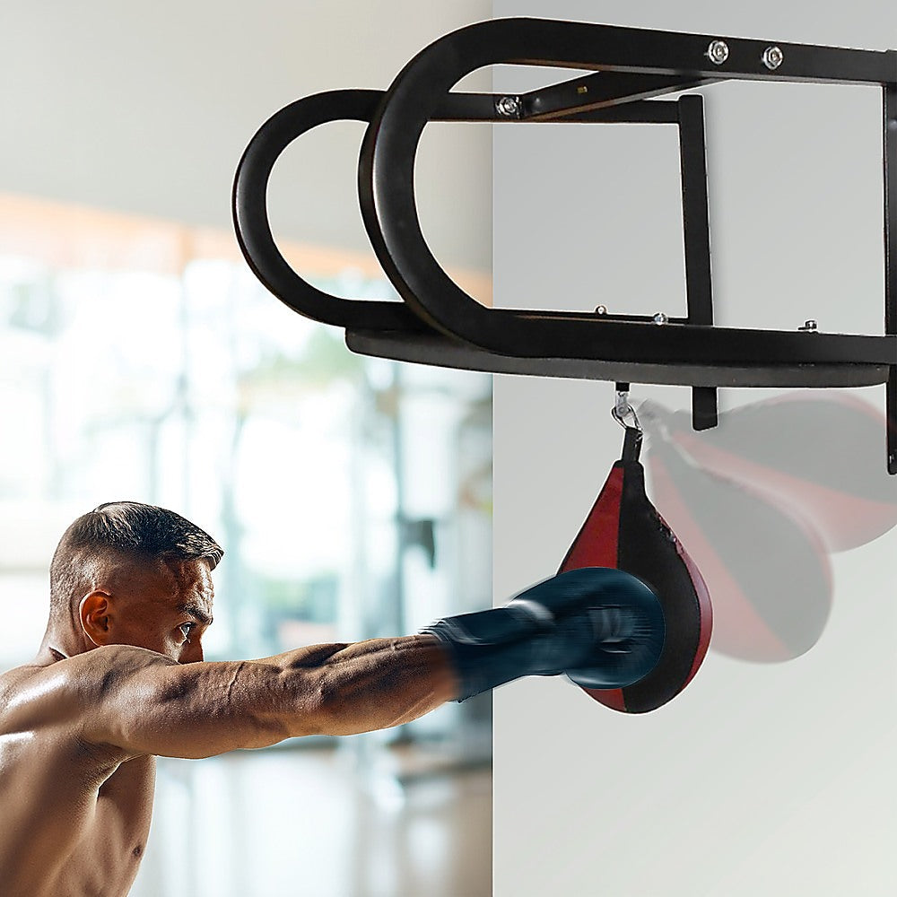 Speedball boxing punching bag training set with wall frame for home gym fitness and martial arts practice.