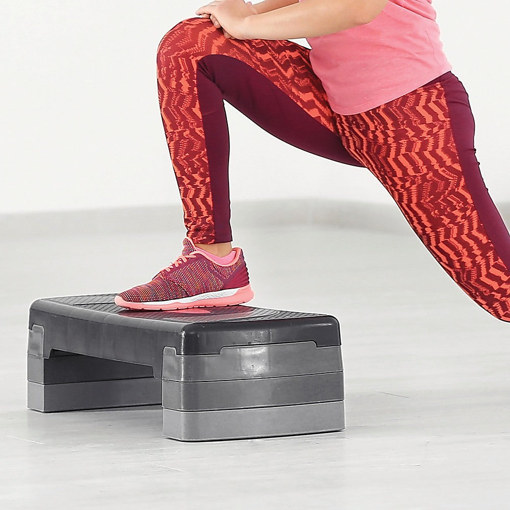 Adjustable aerobic step platform for gym and home workouts, featuring a sturdy design and non-slip surface by Online Fitness Depot.