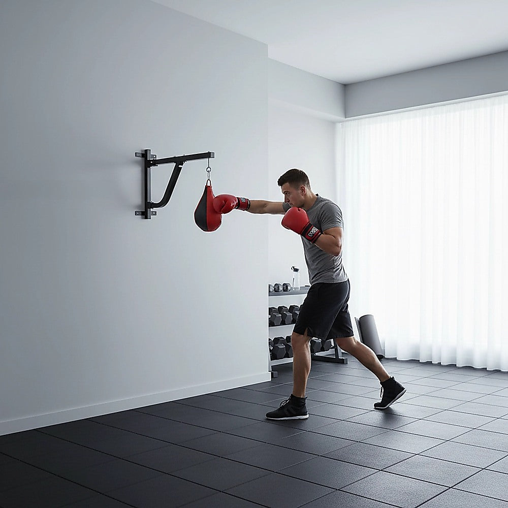 Boxing punching bag wall pivot rack with swivel mount for home gym fitness, suitable for boxing and martial arts training.