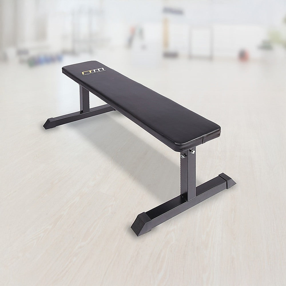 Flat weight bench for home gym workouts, featuring a sturdy design for strength training exercises.