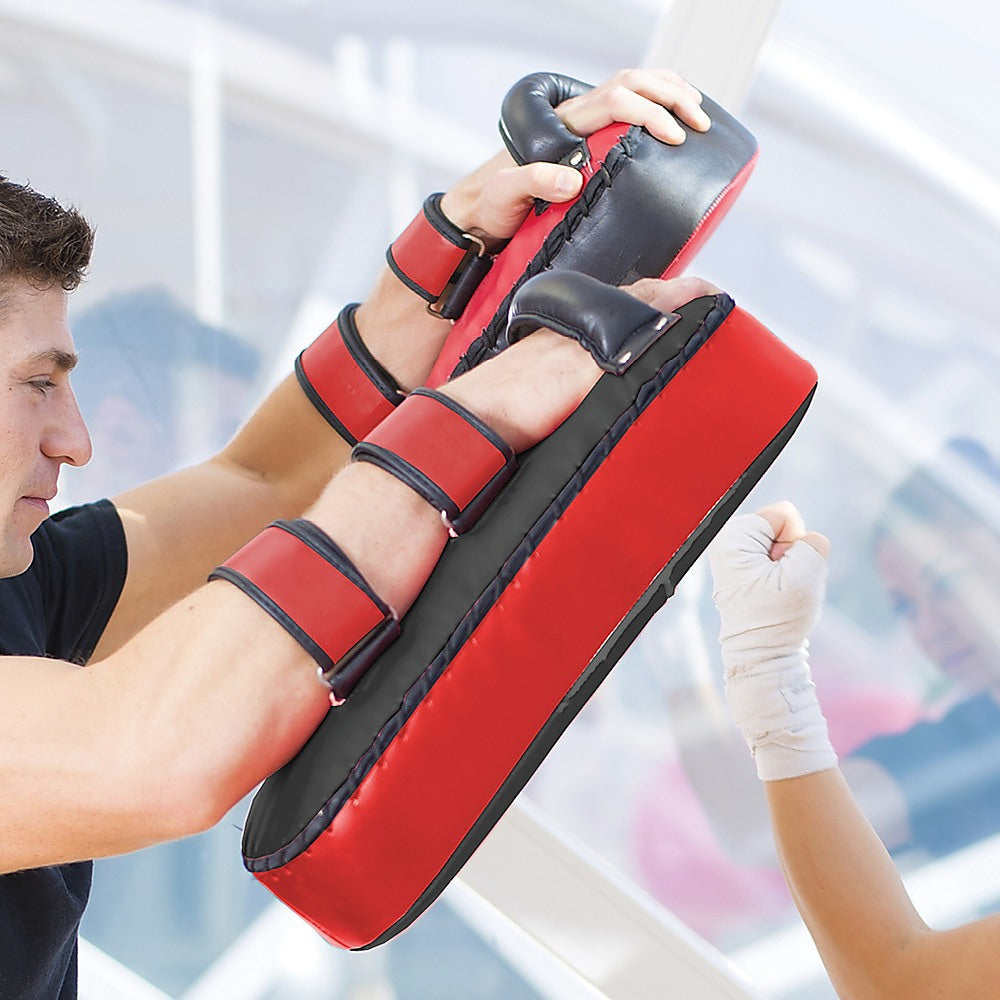 Thai pads kickboxing punching shield from Online Fitness Depot, showing padded surface and handle grips for martial arts training.