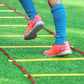 Online Fitness Depot 9m agility speed training ladder for sports and fitness exercises, with brightly colored rungs on a flat surface.