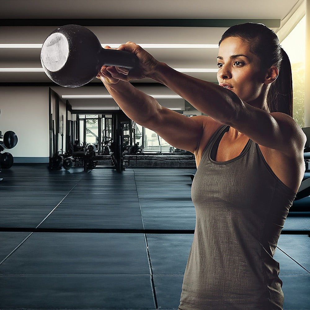 16kg concrete kettlebell for strength training, shown on a gym floor, designed for home gym fitness and weightlifting exercises.