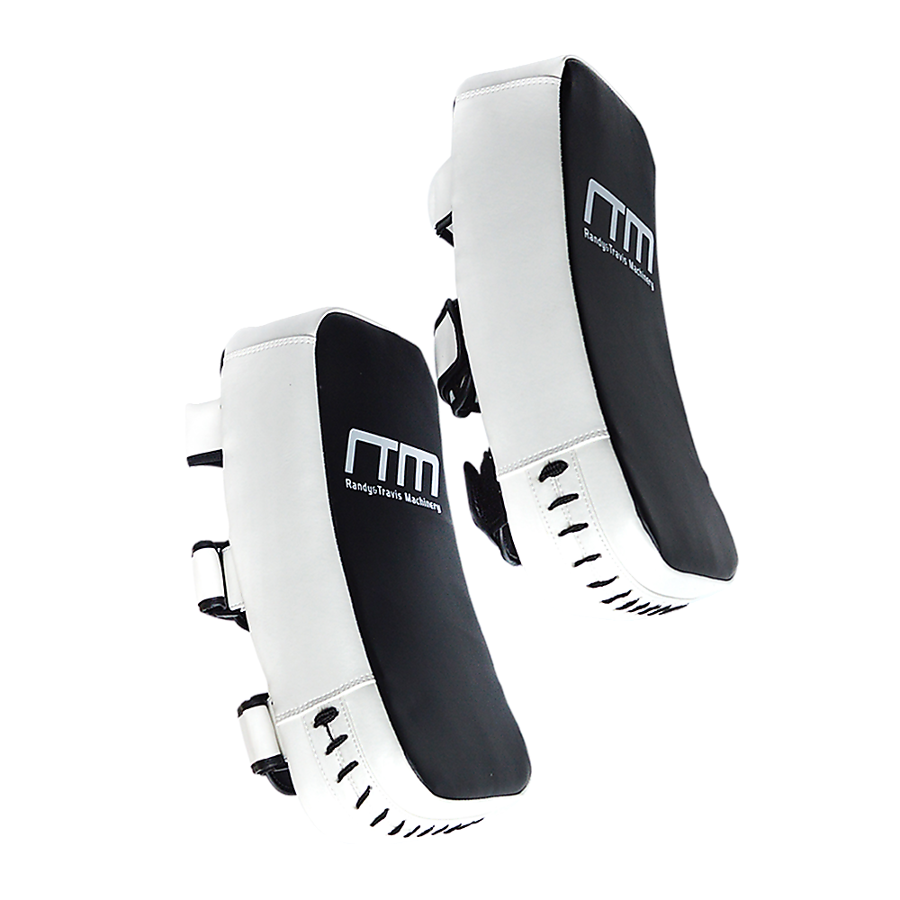 Muay Thai kick boxing pad strike shield used for martial arts training, featuring padded surface and adjustable straps for boxing drills.