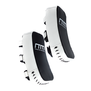 Muay Thai kick boxing pad strike shield used for martial arts training, featuring padded surface and adjustable straps for boxing drills.