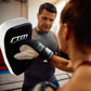Muay Thai focus punching pad from Online Fitness Depot, MMA kick boxing strike shield for martial arts training.