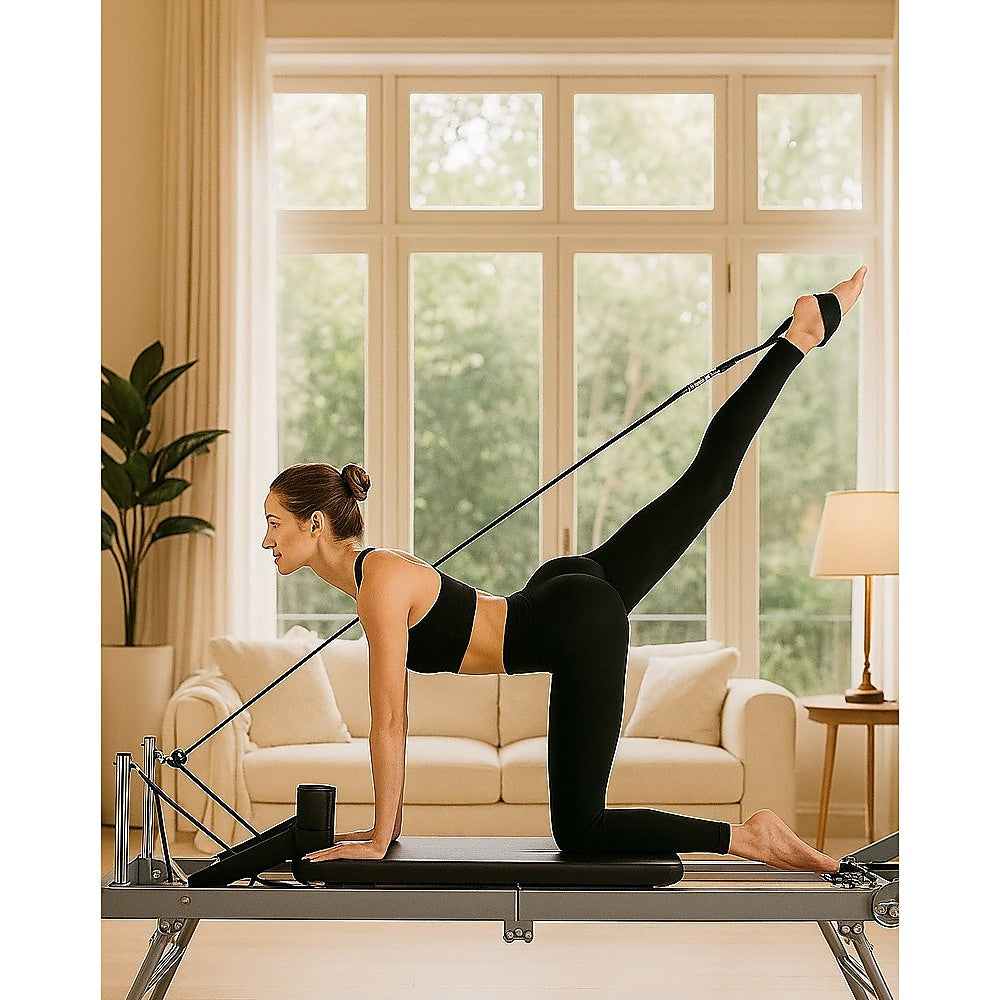 Foldable Pilates Reformer Machine by Online Fitness Depot, compact gym equipment for Pilates and exercise workouts.