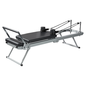 Foldable Pilates Reformer Machine by Online Fitness Depot for yoga and Pilates workouts, featuring a compact design and adjustable resistance.