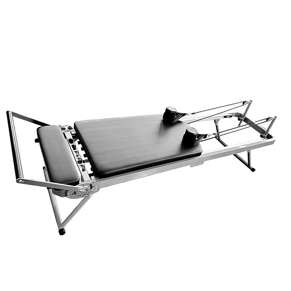 Foldable Pilates Reformer Machine by Online Fitness Depot with adjustable straps and padded carriage for effective yoga and Pilates workouts.