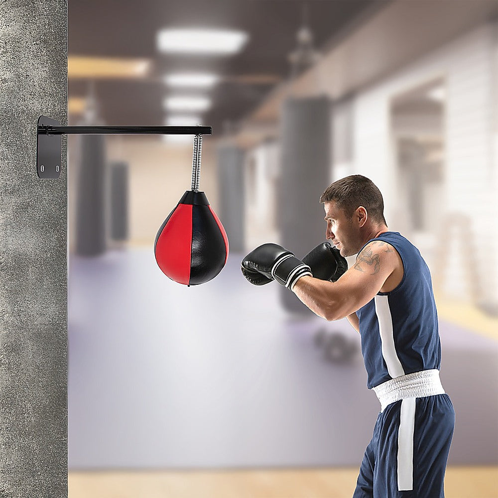 Speed bag boxing punch bag wall mount for reflex training, shown hanging on a wall with a speed ball and mounting hardware.