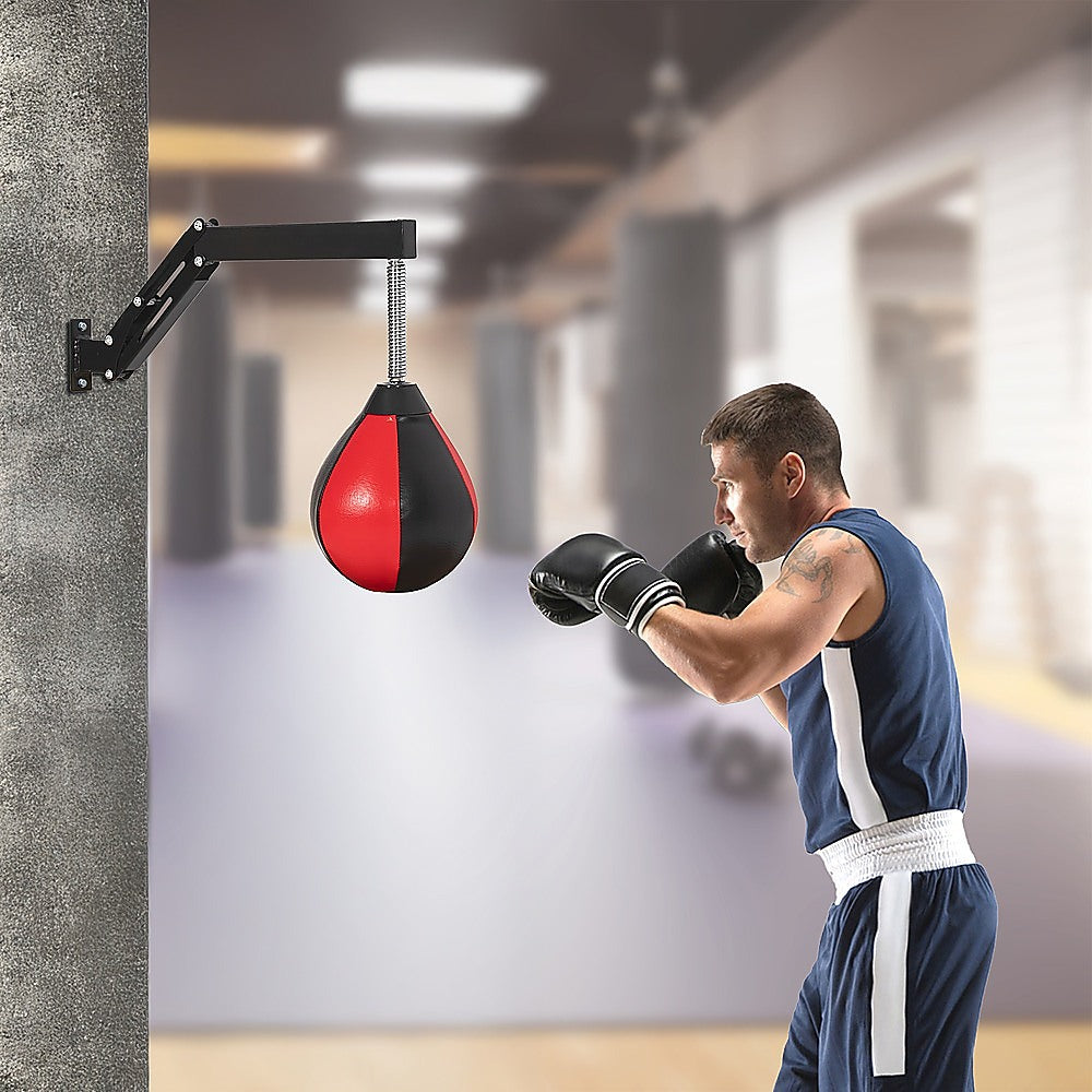 Speed bag punching boxing bag wall mount for reflex training, used in boxing and martial arts workouts.