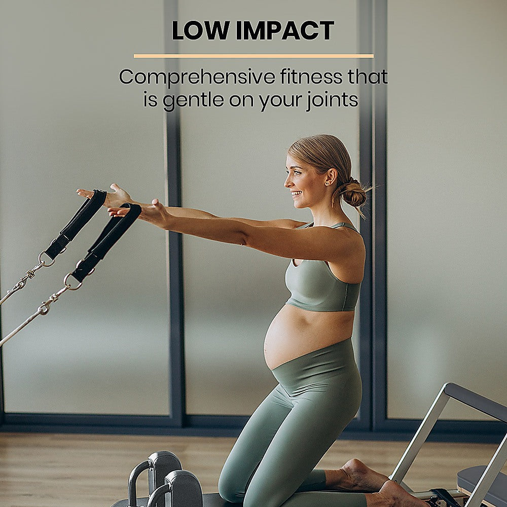Folding Pilates reformer machine for full-body fitness training, with padded carriage, resistance springs, and adjustable straps.