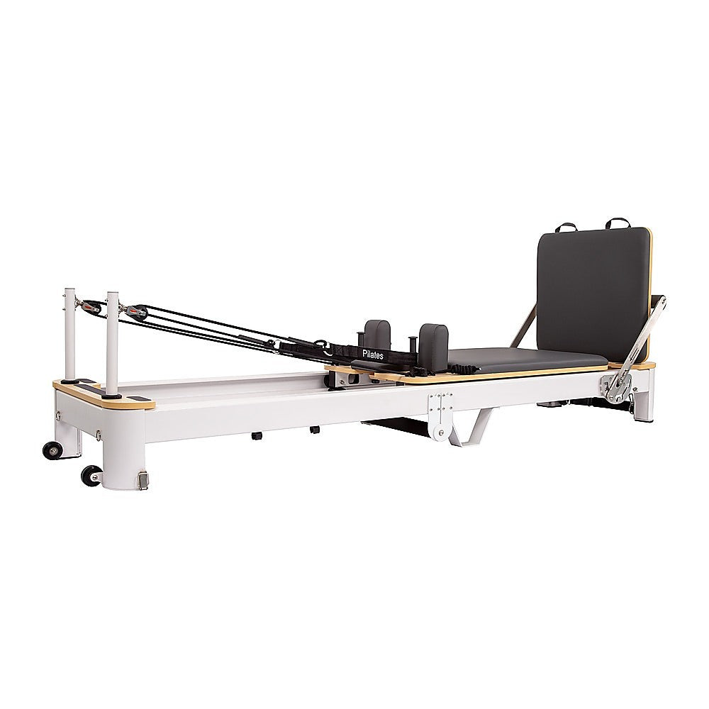 Folding Pilates Reformer machine by Online Fitness Depot, compact home workout bed for full-body yoga and Pilates exercises.