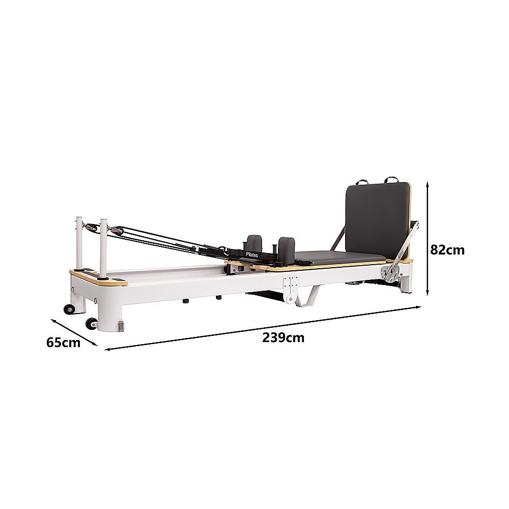 Folding Pilates Reformer machine by Online Fitness Depot with padded carriage, adjustable straps, and compact design for full-body workouts.