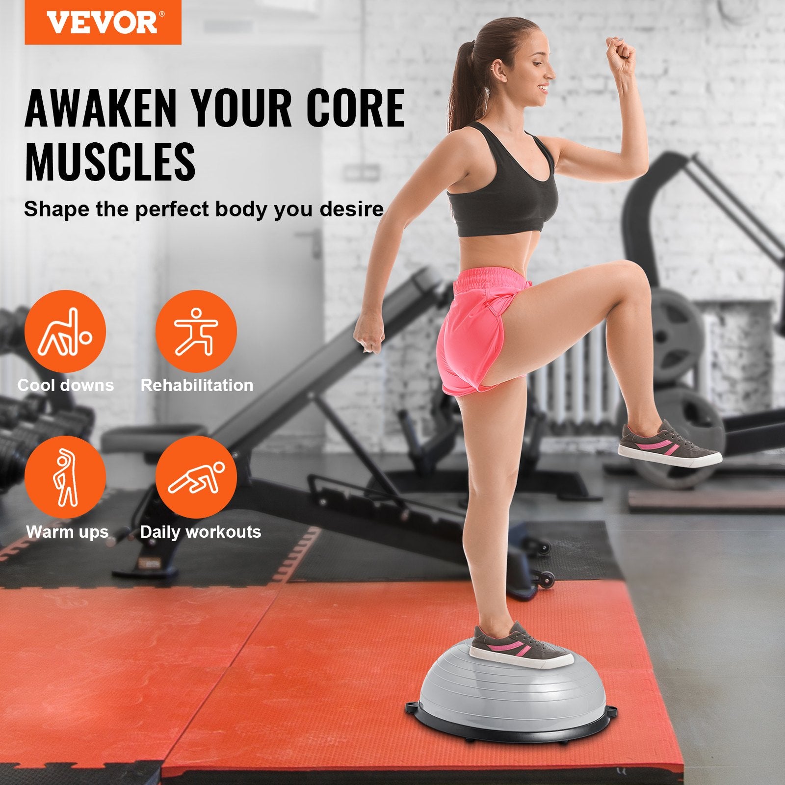 Gray 23-inch balance ball trainer with resistance bands and foot pump, used for full body workouts and stability exercises.